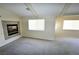 Bright bedroom with natural light streaming through multiple windows and a fireplace feature at 5808 Amber Station Ave, Las Vegas, NV 89131