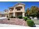 Beautiful two-story home with a charming balcony, well-maintained landscaping, and a welcoming facade at 5808 Amber Station Ave, Las Vegas, NV 89131