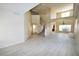 Open-concept living room with tile flooring, staircase, lots of natural light, and a flowing layout at 5808 Amber Station Ave, Las Vegas, NV 89131
