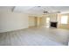 Large living room featuring tile floors, recessed lighting, fireplace, and neutral color paint throughout at 5808 Amber Station Ave, Las Vegas, NV 89131