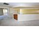 Spacious living room with a built-in cabinet and neutral carpet flooring at 5808 Amber Station Ave, Las Vegas, NV 89131