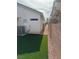 Cozy backyard with artificial turf and stone walkway, perfect for outdoor relaxation at 6022 Highland Gardens Dr, North Las Vegas, NV 89031