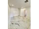 Spacious bedroom with marble floors, recessed lighting, and a large closet at 6022 Highland Gardens Dr, North Las Vegas, NV 89031
