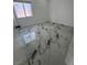 Modern bedroom with marble flooring and a window, providing lots of natural light at 6022 Highland Gardens Dr, North Las Vegas, NV 89031