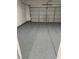 Well-kept garage interior featuring epoxy flooring and an insulated, sectional garage door at 6022 Highland Gardens Dr, North Las Vegas, NV 89031