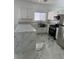 Beautiful kitchen with white cabinets, granite countertops, and stainless steel appliances at 6022 Highland Gardens Dr, North Las Vegas, NV 89031
