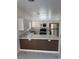Modern kitchen featuring stainless steel appliances, marble countertops, and stylish white cabinetry at 6022 Highland Gardens Dr, North Las Vegas, NV 89031