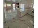 Open-concept kitchen and living room with marble tile flooring and lots of natural light at 6022 Highland Gardens Dr, North Las Vegas, NV 89031