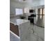 Modern kitchen boasts an island, stainless steel appliances, and sleek countertops at 6022 Highland Gardens Dr, North Las Vegas, NV 89031