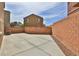 Spacious backyard featuring concrete patio and rock landscaping, enclosed for privacy and ready for customization at 6207 Hamilton Ave, Las Vegas, NV 89122