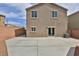 Spacious backyard with concrete patio, providing ample space for outdoor activities, enclosed by brick walls at 6207 Hamilton Ave, Las Vegas, NV 89122