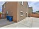 Backyard with concrete patio, offering a versatile outdoor space and an enclosed fence for privacy at 6207 Hamilton Ave, Las Vegas, NV 89122