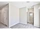 Neutral bedroom featuring gray carpet, white walls and a white entry door at 6207 Hamilton Ave, Las Vegas, NV 89122