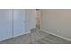 This bedroom features gray carpet and double door closet with white trim at 6207 Hamilton Ave, Las Vegas, NV 89122
