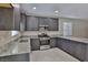 Beautiful kitchen featuring granite countertops, gray cabinets, and stainless steel appliances at 6207 Hamilton Ave, Las Vegas, NV 89122
