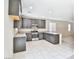 Bright and airy kitchen featuring stainless steel appliances, granite countertops and tile flooring at 6207 Hamilton Ave, Las Vegas, NV 89122