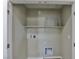 Functional laundry room space with a shelf, washer hookups, and dryer hookups ready for appliances at 6207 Hamilton Ave, Las Vegas, NV 89122