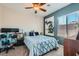 Cozy bedroom with stylish decor, comfortable furnishings, and plenty of natural light at 6446 Button Quail St, North Las Vegas, NV 89084