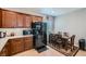 Bright kitchen featuring wooden cabinets, stainless steel appliances, and a dining area at 6446 Button Quail St, North Las Vegas, NV 89084