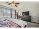 Relaxing main bedroom with neutral colors, plush carpeting, and ample natural light at 6446 Button Quail St, North Las Vegas, NV 89084