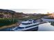 Luxurious yacht docked at Lake Las Vegas near a golf course and waterfront properties at 66 Via Montoro, Henderson, NV 89015