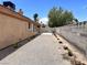 Spacious backyard with gravel, block wall, and concrete patio, ideal for landscaping at 6600 Silver Penny Ave, Las Vegas, NV 89108