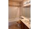 Standard bathroom features tile shower and a sink with wood cabinetry at 6600 Silver Penny Ave, Las Vegas, NV 89108