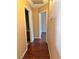 Hallway showcasing hardwood floors connecting various rooms at 6600 Silver Penny Ave, Las Vegas, NV 89108