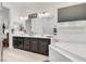 Bright bathroom with double sinks, soaking tub, and modern fixtures at 676 Otter Brook St, Henderson, NV 89011