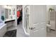 Bathroom featuring vanity with corner tub, glass shower, toilet, and closet view at 676 Otter Brook St, Henderson, NV 89011