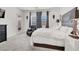 Spacious bedroom featuring plush carpet, chair, and a serene color palette at 676 Otter Brook St, Henderson, NV 89011