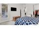 Bright bedroom featuring modern furnishings, television, and closet at 676 Otter Brook St, Henderson, NV 89011