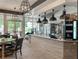Modern cafe area with pendant lighting, ample seating, and floor-to-ceiling windows at 676 Otter Brook St, Henderson, NV 89011