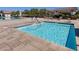 Inviting hot tub with clear blue water and easy access steps, surrounded by a brick patio at 676 Otter Brook St, Henderson, NV 89011