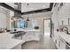 Modern kitchen featuring white cabinets, a center island with seating, and stainless steel appliances at 676 Otter Brook St, Henderson, NV 89011
