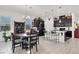 Bright kitchen with black cabinets, a dining area, and modern appliances at 676 Otter Brook St, Henderson, NV 89011
