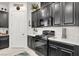 Modern kitchen featuring black appliances, stylish countertops, and ample cabinet space at 676 Otter Brook St, Henderson, NV 89011