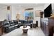 Comfortable living room featuring stylish furniture and ample natural light at 676 Otter Brook St, Henderson, NV 89011