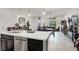 Bright, open-concept living and dining area with white walls and modern decor at 676 Otter Brook St, Henderson, NV 89011