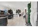 Bright open-concept living space with sleek tile flooring and modern decor at 676 Otter Brook St, Henderson, NV 89011