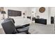 Comfortable main bedroom showcasing a recliner and view into ensuite bathroom at 676 Otter Brook St, Henderson, NV 89011