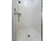 Clean and modern shower stall featuring white tile and updated fixtures at 676 Otter Brook St, Henderson, NV 89011