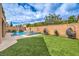 Well-manicured backyard with lush lawn, perfect for outdoor activities and relaxation at 689 Sea Star St, Henderson, NV 89002