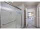 Walk in frosted glass shower with stainless steel hardware and view into bedroom at 689 Sea Star St, Henderson, NV 89002