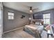 Bedroom with neutral gray walls, carpet and a large mounted TV at 689 Sea Star St, Henderson, NV 89002