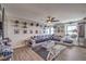 Large bonus room with fan, laminate floors and Star Wars decorations at 689 Sea Star St, Henderson, NV 89002
