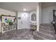 Inviting foyer with tile flooring, stairs, and decorative accents creating a warm entry at 689 Sea Star St, Henderson, NV 89002