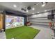 Impressive media room with projector screen and comfortable seating to relax and enjoy at 689 Sea Star St, Henderson, NV 89002