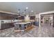 Bright kitchen with granite countertops, central island with barstool seating and stainless steel appliances at 689 Sea Star St, Henderson, NV 89002