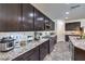 Modern kitchen features granite countertops, tile backsplash, and stainless steel appliances at 689 Sea Star St, Henderson, NV 89002